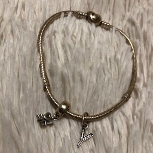 Silver pandora bracelet, charms included